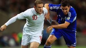 Outta my way: Global superstar Wayne Rooney shrugs off San Marino part-timer
